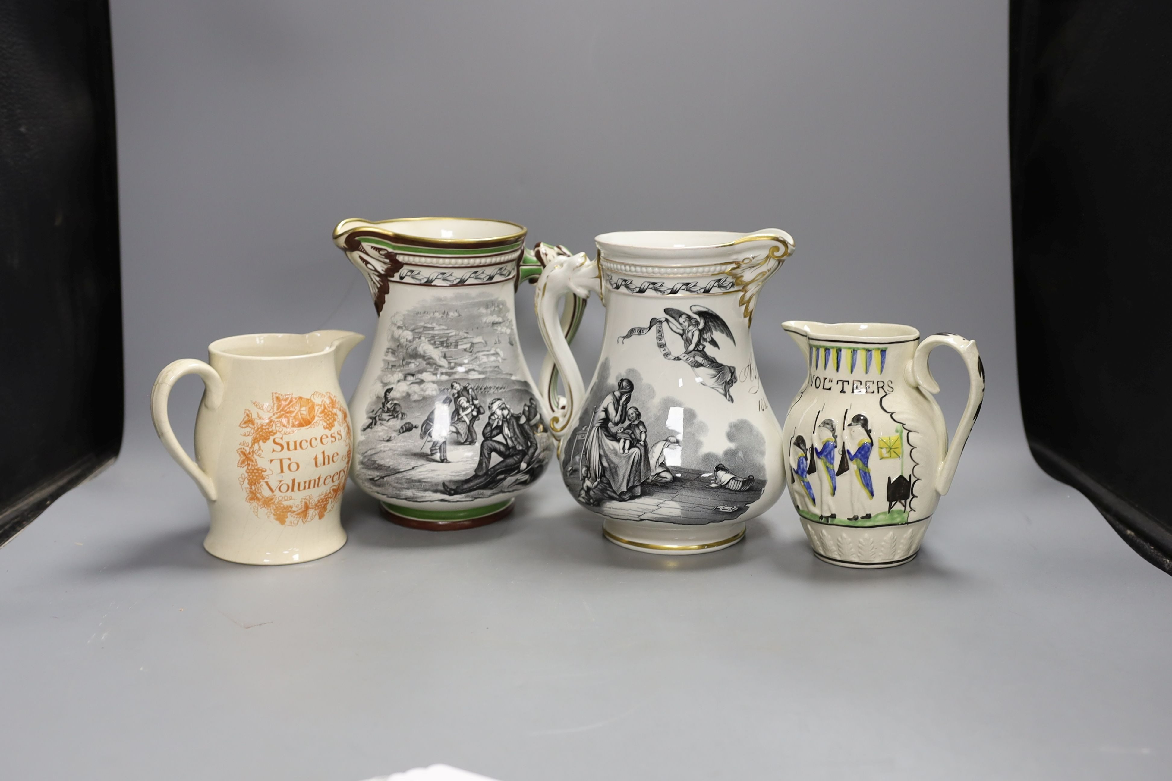 A Success to the Volunteers pearlware ‘Master Boney’ jug, c.1800, two Samuel Alcock Royal Patriotic jugs and a Leeds pottery relief-moulded Volunteer's jug and a transfer-printed jug.